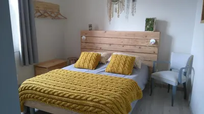 Un ou plusieurs lits dans un hébergement de l'établissement Le jardin des Écureuils