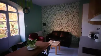 Coin salon dans l'établissement Le jardin des Écureuils
