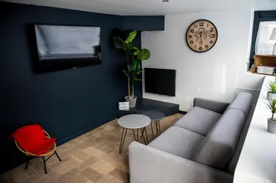 Télévision ou salle de divertissement dans l'établissement Le cottage du clos des Forges