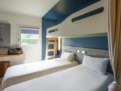 Un ou plusieurs lits dans un hébergement de l'établissement Ibis budget Rouen Petit Quevilly