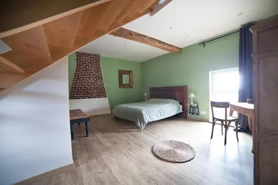 Un ou plusieurs lits dans un hébergement de l'établissement Les Chambres d'hotes de Sophie