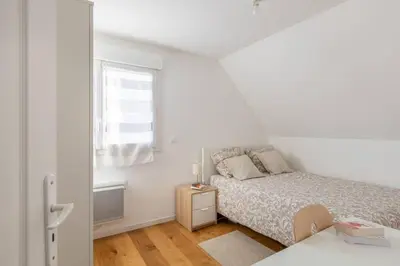 Un ou plusieurs lits dans un hébergement de l'établissement GRAND CONFORT, Appartement Osny