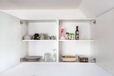 Cuisine ou kitchenette dans l'établissement GRAND CONFORT, Appartement Osny