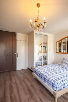 Un ou plusieurs lits dans un hébergement de l'établissement Grand Appartement de 3 pièces
