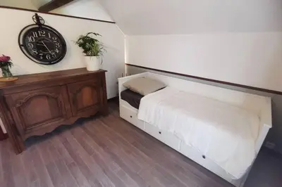 Un ou plusieurs lits dans un hébergement de l'établissement Gîte Le Balcon Flaubert