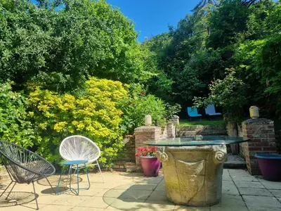 Jardin de l'établissement Escapade en amoureux loft de charme jacuzzi et jardin privé proche Paris