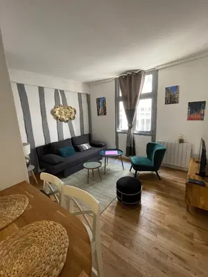 Coin salon dans l'établissement Charmant T1 Vieux Rouen