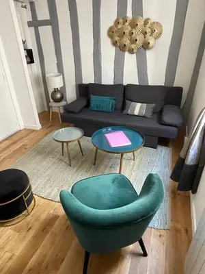 Coin salon dans l'établissement Charmant T1 Vieux Rouen
