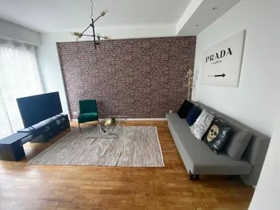 Coin salon dans l'établissement Appartement vue beffroi