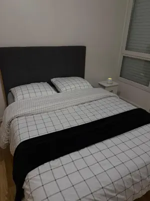 Un ou plusieurs lits dans un hébergement de l'établissement SPACIEUX Appartement de Charme, près de Paris
