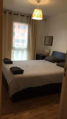 Un ou plusieurs lits dans un hébergement de l'établissement SPACIEUX Appartement de Charme, près de Paris