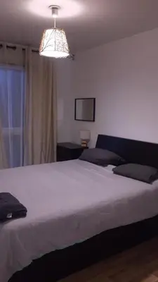 Un ou plusieurs lits dans un hébergement de l'établissement SPACIEUX Appartement de Charme, près de Paris