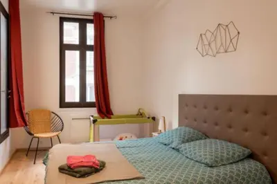 Un ou plusieurs lits dans un hébergement de l'établissement Charmant Dieppois, 2 chambres, centre ville