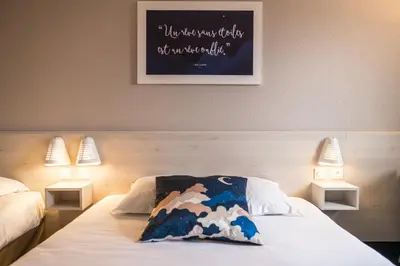 Un ou plusieurs lits dans un hébergement de l'établissement ACE Hôtel Rouen Parc des Expositions