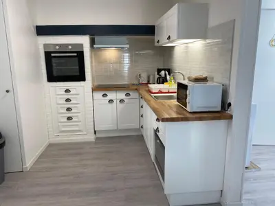 Cuisine ou kitchenette dans l'établissement L’Abri Côtier