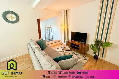 Télévision ou salle de divertissement dans l'établissement Duplex au pied de la gare - NETFLIX - Hyper-centre