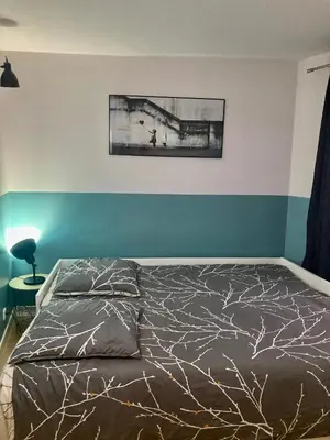 Un ou plusieurs lits dans un hébergement de l'établissement Alex Place's