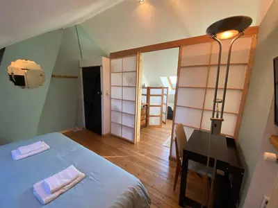 Un ou plusieurs lits dans un hébergement de l'établissement La Chambre Claire