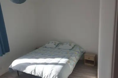 Un ou plusieurs lits dans un hébergement de l'établissement appartement laïs