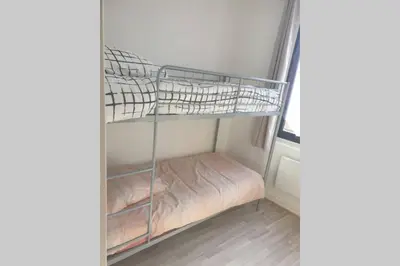 Un ou plusieurs lits dans un hébergement de l'établissement appartement laïs