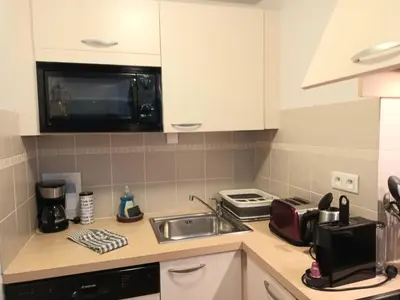 Cuisine ou kitchenette dans l'établissement La Vicomté - Quai Henri IV - WIFI gratuit