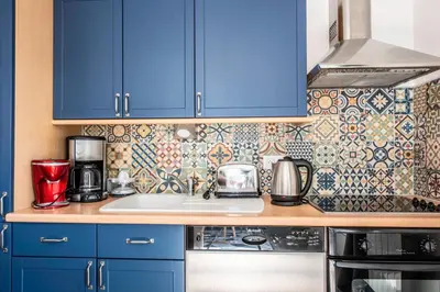 Cuisine ou kitchenette dans l'établissement El arco iris entre port et plage