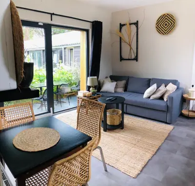 Coin salon dans l'établissement Appartement Beau Séjour - Accès Piscine