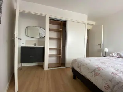 Un ou plusieurs lits dans un hébergement de l'établissement La Villa Marine BY HOLIDIEPPE