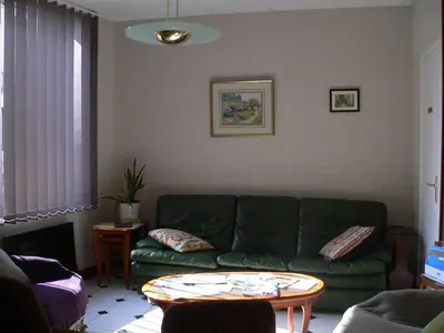 Coin salon dans l'établissement Hôtel le cygne