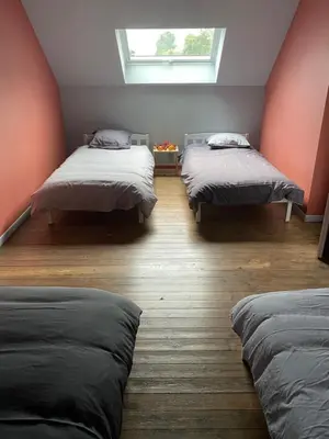 Un ou plusieurs lits dans un hébergement de l'établissement Gîte les Retrouvailles