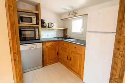 Cuisine ou kitchenette dans l'établissement Gîte Plume et Potiron