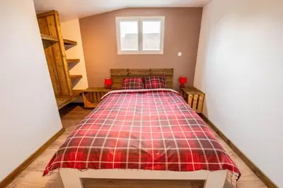 Un ou plusieurs lits dans un hébergement de l'établissement Gîte Plume et Potiron