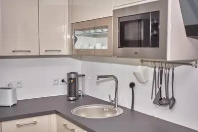 Cuisine ou kitchenette dans l'établissement La vallée des Hortillonages