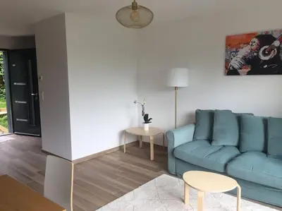 Coin salon dans l'établissement Superbe appartement avec vue sur la tour Eiffel