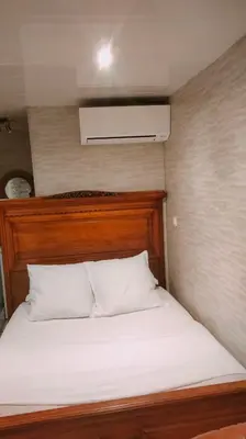 Un ou plusieurs lits dans un hébergement de l'établissement Chambre meublée indépendante, jacuzzi dans la chambre à 60110 Amblainville près de Paris