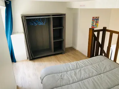 Un ou plusieurs lits dans un hébergement de l'établissement Résidence chêne percé Appartement au RDC 51 m2