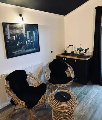 Coin salon dans l'établissement Apt 35 m2 Baignoire Balnéo terrasse privée