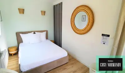 Un ou plusieurs lits dans un hébergement de l'établissement Cosy Normandy - 04
