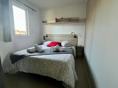 Un ou plusieurs lits dans un hébergement de l'établissement Paris Camping Ile du Roi