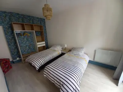 Un ou plusieurs lits dans un hébergement de l'établissement DIEPPE au coeur du cville-Calme avec balcon