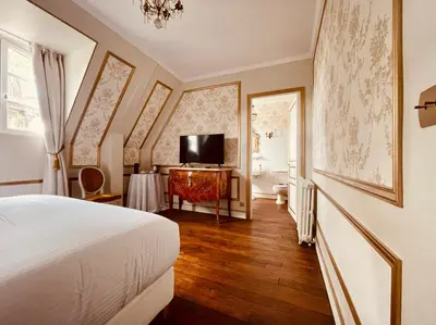 Télévision ou salle de divertissement dans l'établissement Château du Prieuré Évecquemont