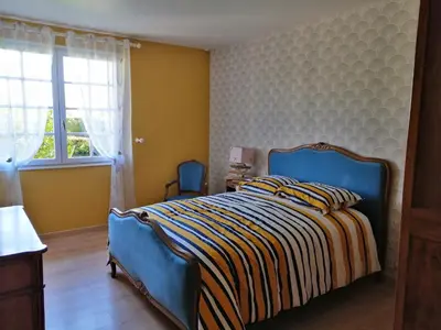 Un ou plusieurs lits dans un hébergement de l'établissement Maison calme avec jardin, Petit-Caux