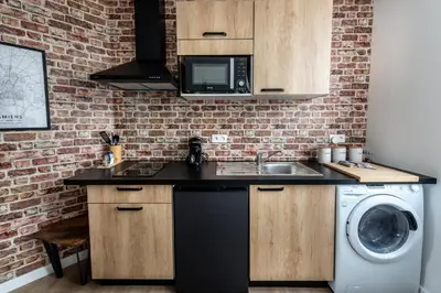 Cuisine ou kitchenette dans l'établissement Location d'appartements - Cosysejour - Calme Fibre Netflix