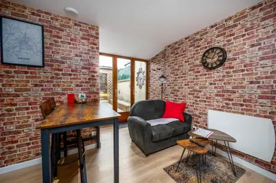 Coin salon dans l'établissement Location d'appartements - Cosysejour - Calme Fibre Netflix
