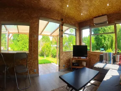 Télévision ou salle de divertissement dans l'établissement Le Cottage des Hortillonnages