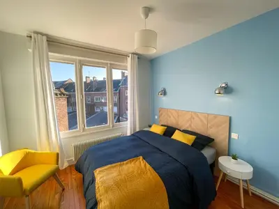 Un ou plusieurs lits dans un hébergement de l'établissement Cinéma & Disney avec Balcon & Parking en Hyper Centre