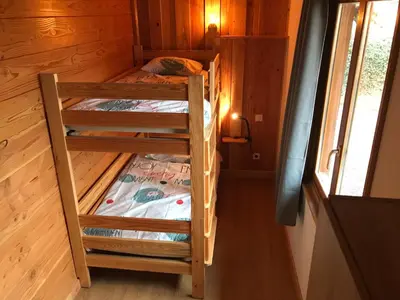 Un ou plusieurs lits dans un hébergement de l'établissement Le chalet