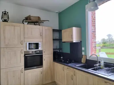 Cuisine ou kitchenette dans l'établissement Les Gîtes du Château de Maltot