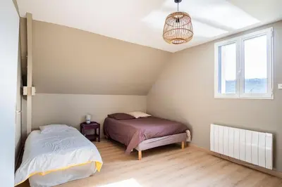 Un ou plusieurs lits dans un hébergement de l'établissement Villa des Vergers