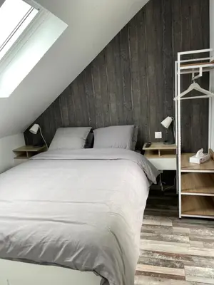 Un ou plusieurs lits dans un hébergement de l'établissement L’Auberge de papa